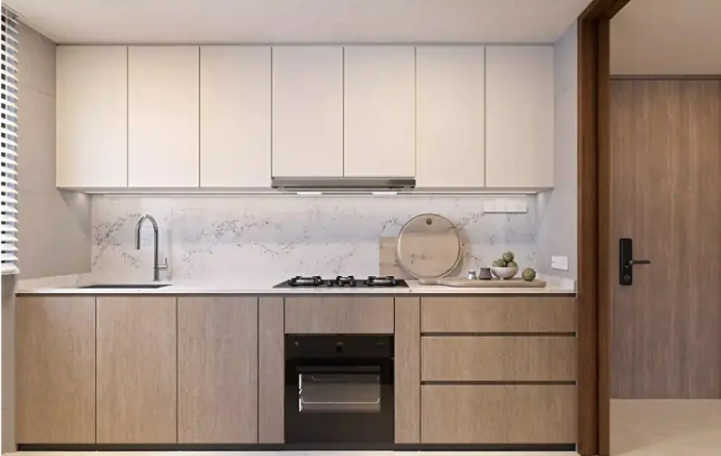 Kitchen Interior: A modern kitchen with sleek cabinetry combining white and light wood finishes. The countertop is a clean marble pattern, with a built-in stovetop and oven, ideal for a comfortable and stylish cooking experience.